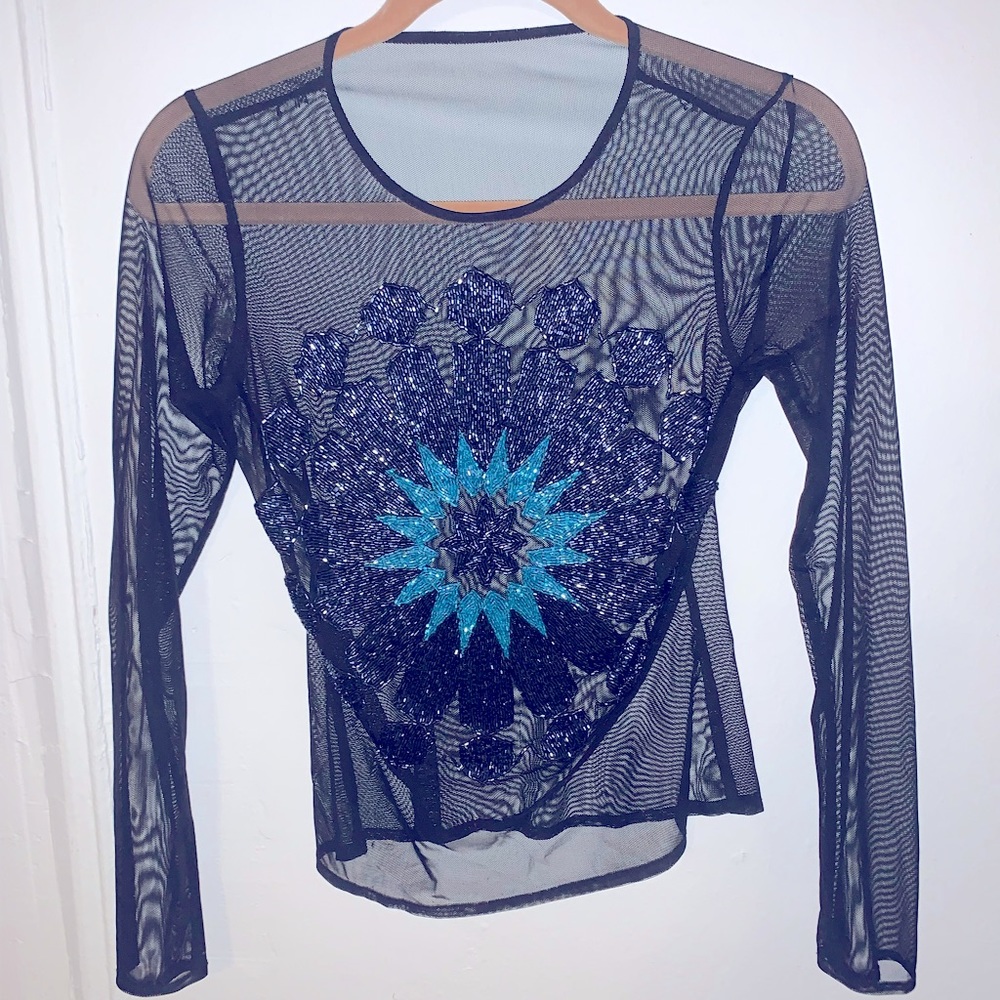 Blasts of classy, intricate beading detail! Women’s shirt from Macy’s